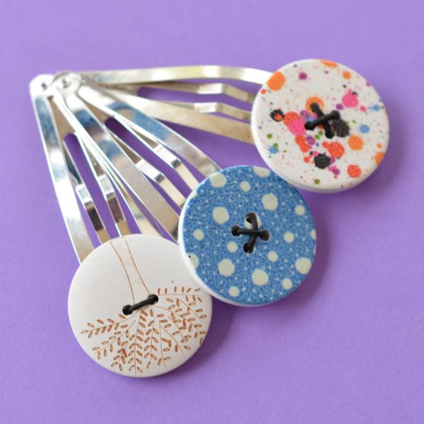 Trio of jumbo button hair clips