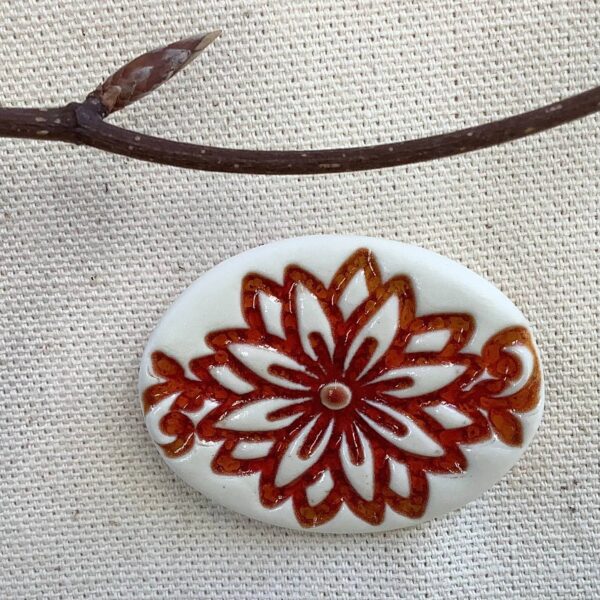 Red Ember Glaze Oval ‘Chrysanthemum' Ceramic Brooch