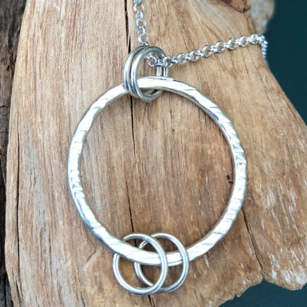 Sterling Silver Hammered Hoop with 2 Symbolic Rings Necklace