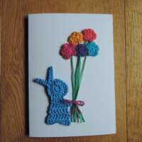 Blue Crochet Bunny Holding Flowers thumbnail