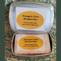 Orange & Clove Solid Shampoo in a tin thumbnail