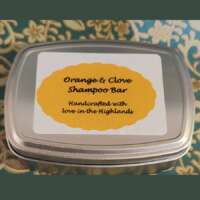 Orange & Clove Solid Shampoo in a tin thumbnail