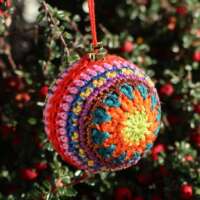Multi-Coloured Crochet Christmas Bauble Green Star thumbnail